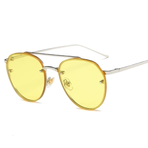 Classic aviator sunglasses with silver metal frame and bright yellow transparent lenses