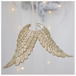 Detail of champagne gold angel wing ornament with fine glitter for Christmas decor