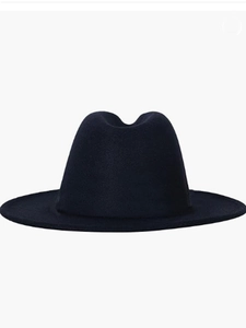 Detailed view of dark blue wool felt fedora hat with fine texture and smooth brim