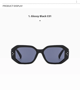 Detail view of glossy black hexagonal sunglasses with triple silver dot metal accents