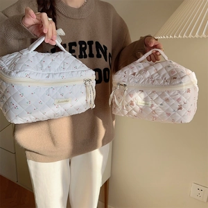 Detailed macro of quilted makeup bags with cute cherry and cartoon bear patterns