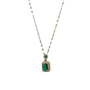 Elegant emerald-cut green gemstone pendant necklace with delicate gold chain for women