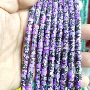 Macro detail of 3x6mm natural amethyst spacer beads for DIY jewelry making and crafts