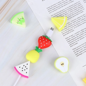Fruit themed cable protectors featuring strawberry, pineapple and watermelon on marble background