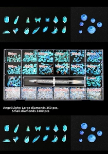 Detail of 21-grid nail art rhinestone kit featuring assorted light blue crystal shapes