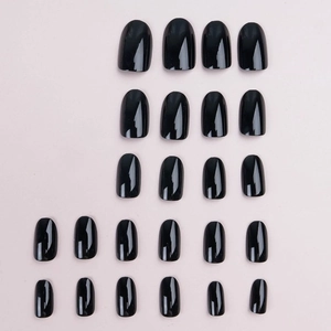 Glossy obsidian black short oval press-on nails set with high-shine mirror finish effect