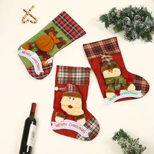 Three Christmas stockings with 3D Santa, Reindeer, and Snowman on festive red plaid