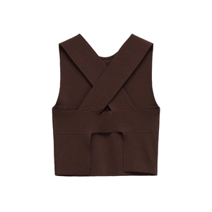 Detail of dark brown ribbed knit crop top featuring a criss-cross open back design