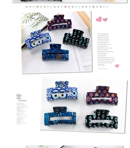 Detail of rectangular hair claws with evil eye patterns in blue, black, and purple