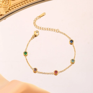 Gold stainless steel bracelet with five colorful round gemstones and lobster clasp