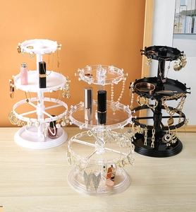 Three-tier rotating jewelry organizer stand in black, white and clear acrylic colors