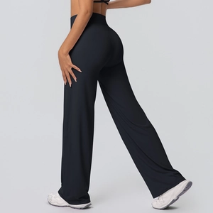 Detail of high-waist yoga flare pants showing elastic fabric and body-shaping fit