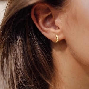 Minimalist S925 sterling silver gold hoop earrings with small diamonds on model ear