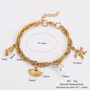 Golden ocean theme bracelet with starfish, seashell, and pearl charms on white background