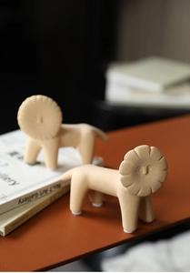 Detail of Nordic lion art ornaments showing the textured ceramic finish and creative design