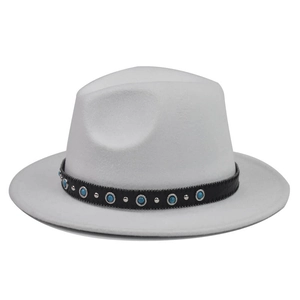 Detailed view of a white wool fedora with a turquoise-studded black leather band.