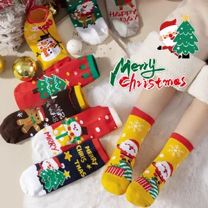 Detail of Christmas themed cotton socks featuring Santa, reindeer and tree patterns