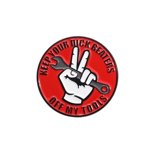 Funny mechanic enamel pin featuring a red hand silhouette holding a wrench and tools quote