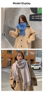 Detail of blue and lavender thick scarves with fringe edges on urban lifestyle models