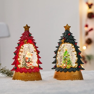 Christmas tree snow globe lantern with festive internal scene and glowing LED lights
