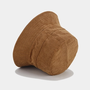 Close-up of brown corduroy bucket hat showing detailed fabric texture and stitching