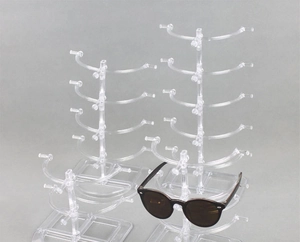 Macro view of clear acrylic sunglasses display stand with multi-layer tiered hooks