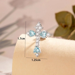 Minimalist silver cross ear piercing stud with light blue zircon and clear stones