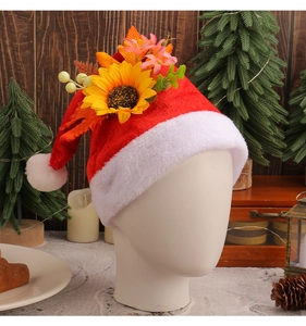 Detail of red plush Santa hat featuring large sunflower decoration on a mannequin