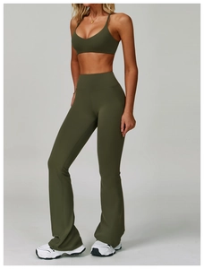 Detail of olive green backless yoga set featuring high-waist flared pants and slim sports bra