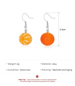 Detail showing creative orange fruit drop earrings with 3.3cm size and alloy hooks