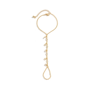 Detail of gold chain hand harness with pearls and rhinestones on white background