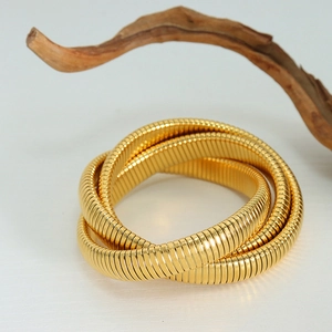 Golden multi-layer interlocking snake chain bracelet with textured metallic weaving design