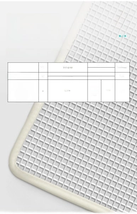 Detail of white non-slip bathroom mat showing dense square grid texture and thick flexible edges