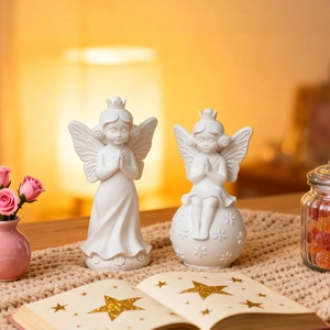 White angel figurine set for home decor featuring a standing and sitting angel