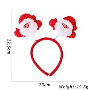 Roter Weihnachts-Haarreif mit Weihnachtsmann-Puppen und Maßen auf weißem Grund