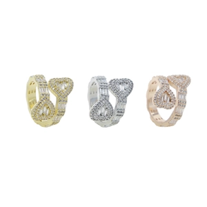 Detailed view of heart bypass rings in gold silver and rose gold with baguette stones