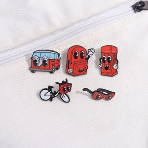Set of 5 vintage red cartoon metal badges including bus, backpack, and telephone booth