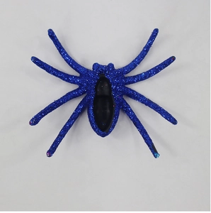Top view of a decorative blue glitter spider prop for Halloween party and haunted house decor