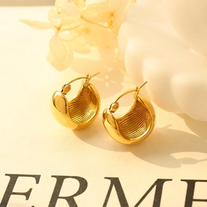 Minimalist U-shaped gold earrings with 18K gold plating and internal radial texture