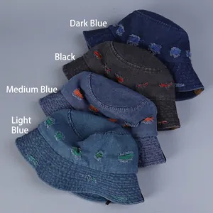 Distressed denim bucket hats in four colors with colorful stitching and ripped details