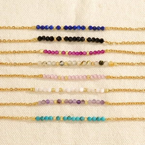 Elegant gold chain bracelet with colorful faceted semi-precious beads in multiple vibrant shades