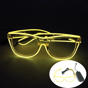 Detail of LED glowing glasses with yellow EL wire and black battery pack controller