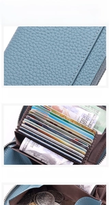 Detail view of blue genuine leather wallet featuring multi-slot card holder and coin pocket