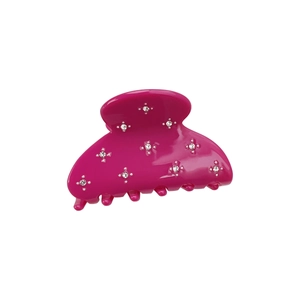 Pink acetate shark hair claw clip with sparkling rhinestone stars on white background