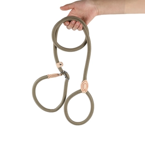 Close-up of a durable olive green braided slip lead leash with leather reinforcement.