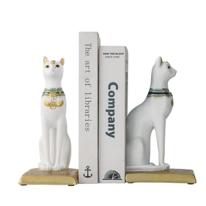 Vintage Egyptian Bastet cat bookends in white matte resin with gold and blue painted details