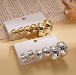 Set of 6 gold and silver C-shaped geometric hoop earrings with textured metal finish