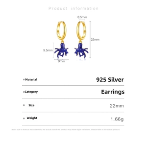 Detailed view of 925 sterling silver hoop earrings with blue polka dot octopus pendant