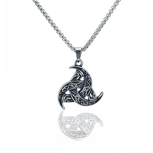 Macro detail of the silver Celtic knot pendant with intricate Nordic braided textures