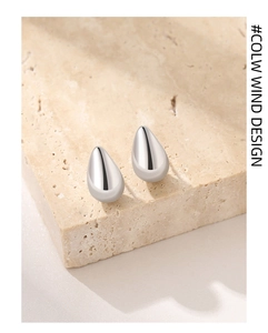Detail view of mirror polished S925 sterling silver waterdrop stud earrings for women